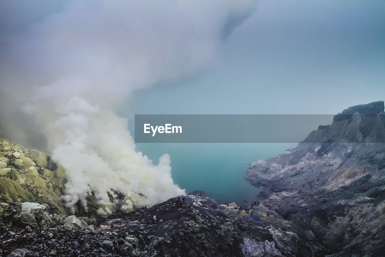 Scenic view of volcanic mountain against sky