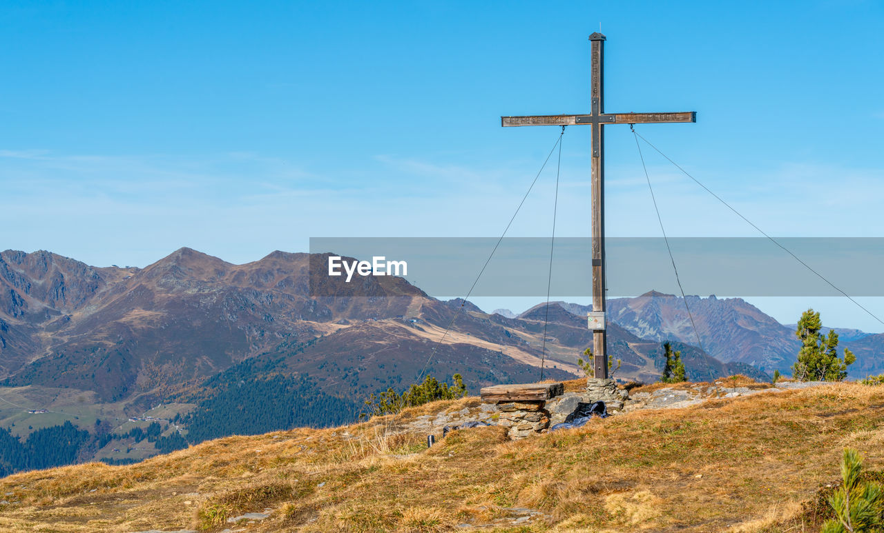 scenic view of mountains against blue sky