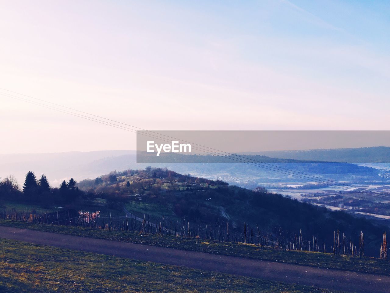 Scenic view of landscape against cloudy sky