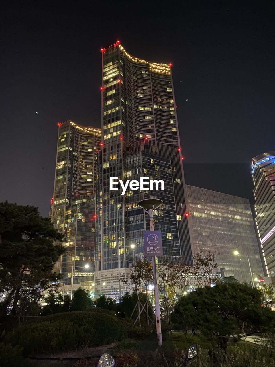 LOW ANGLE VIEW OF ILLUMINATED BUILDINGS