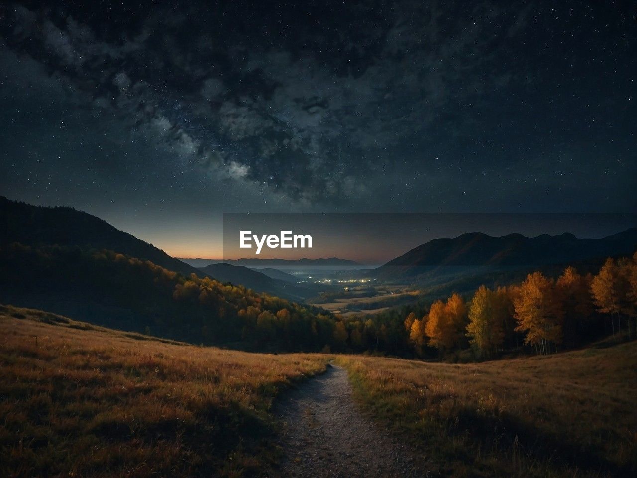 scenic view of mountains against sky at night