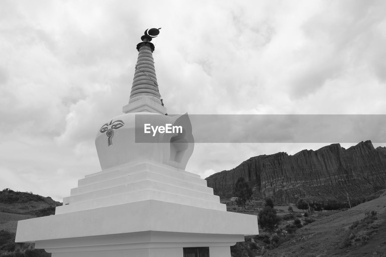 Low angle view of stupa against sky