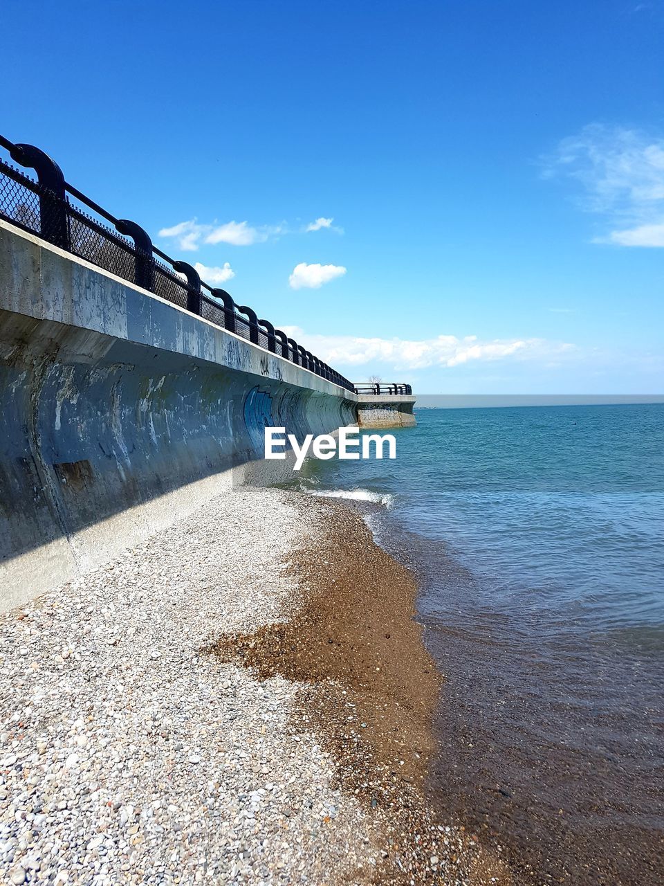 Scenic view of sea against blue sky