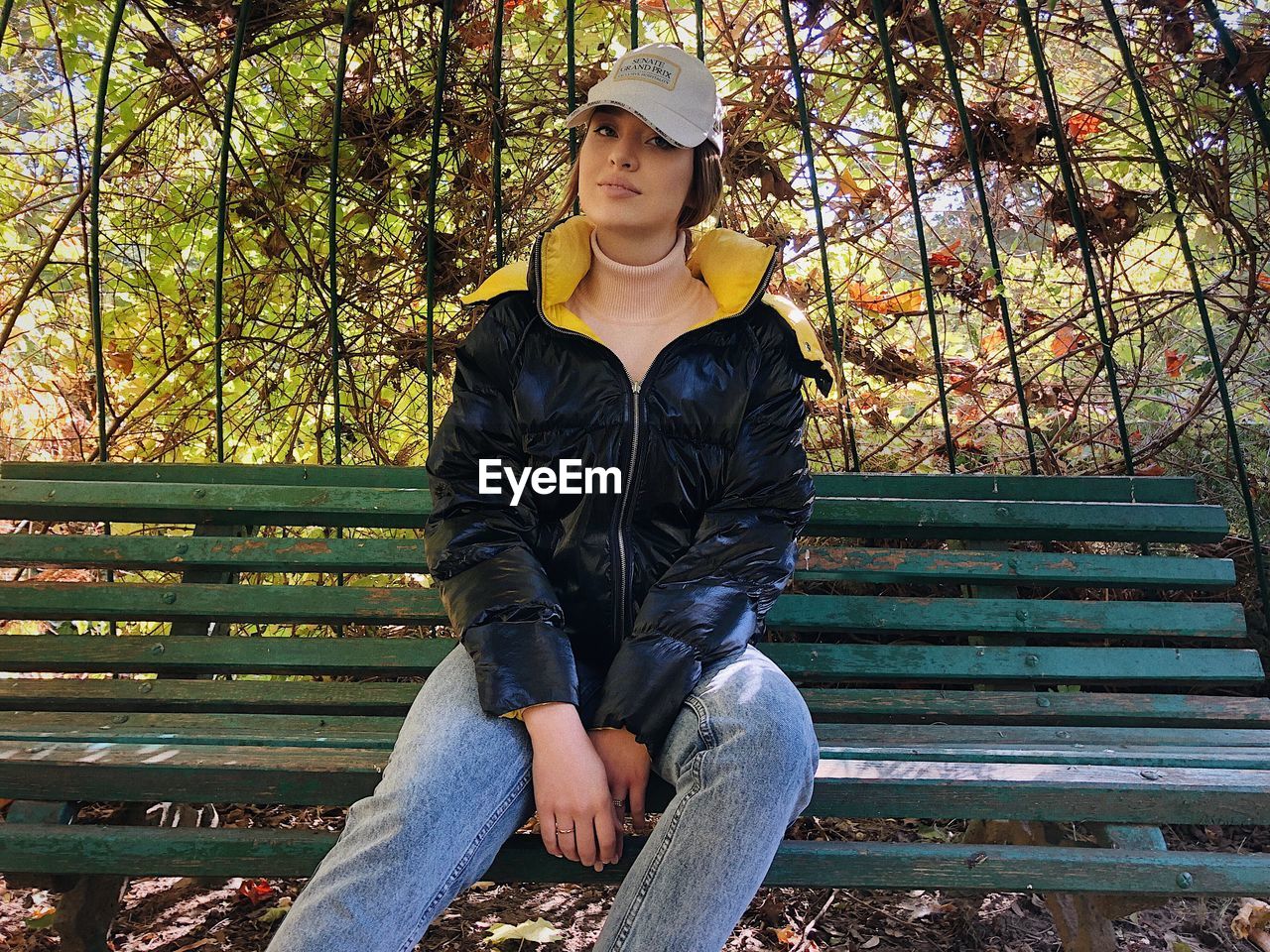 Portrait of young woman sitting on bench