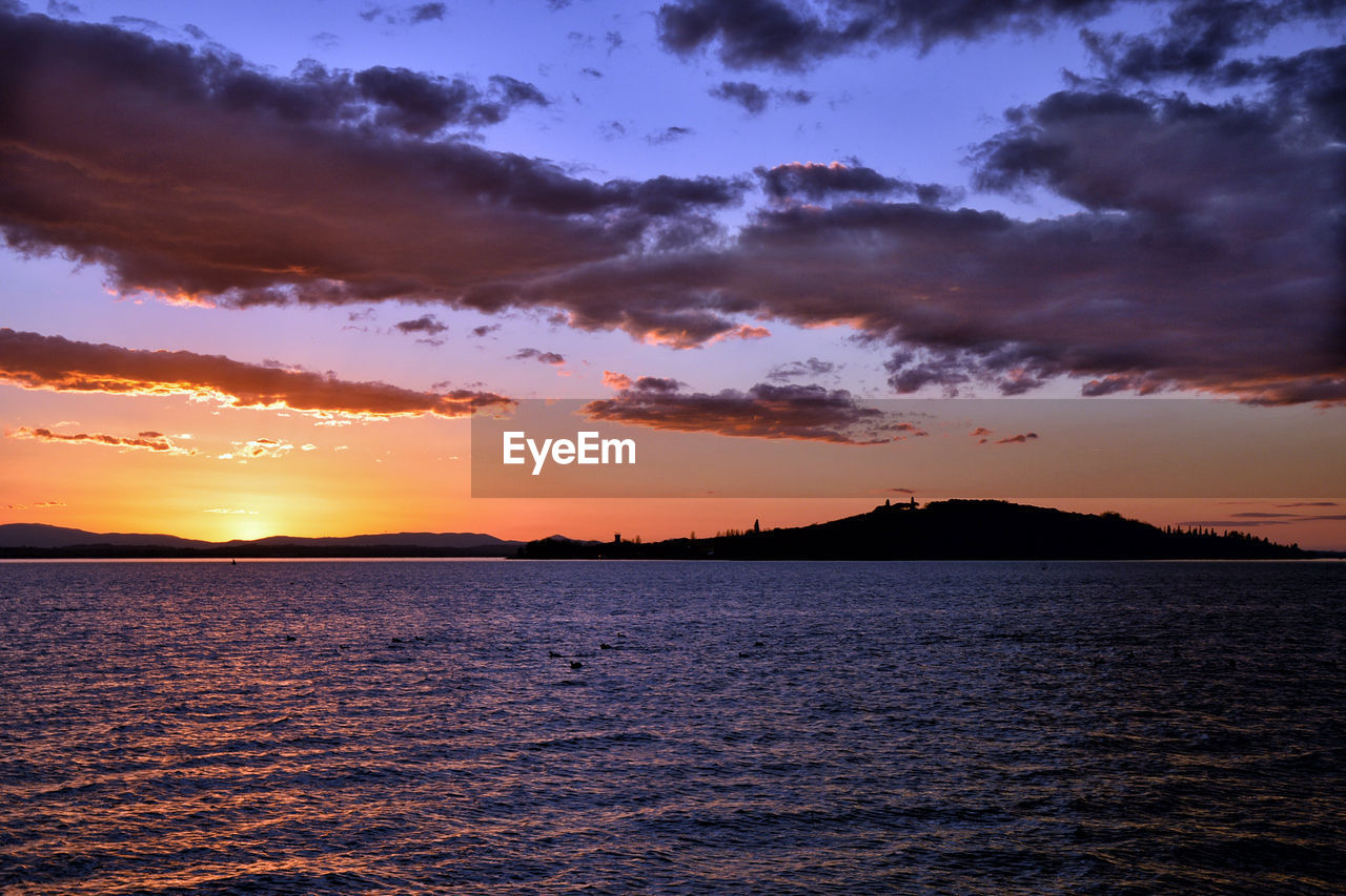 Scenic view of sea against dramatic sky