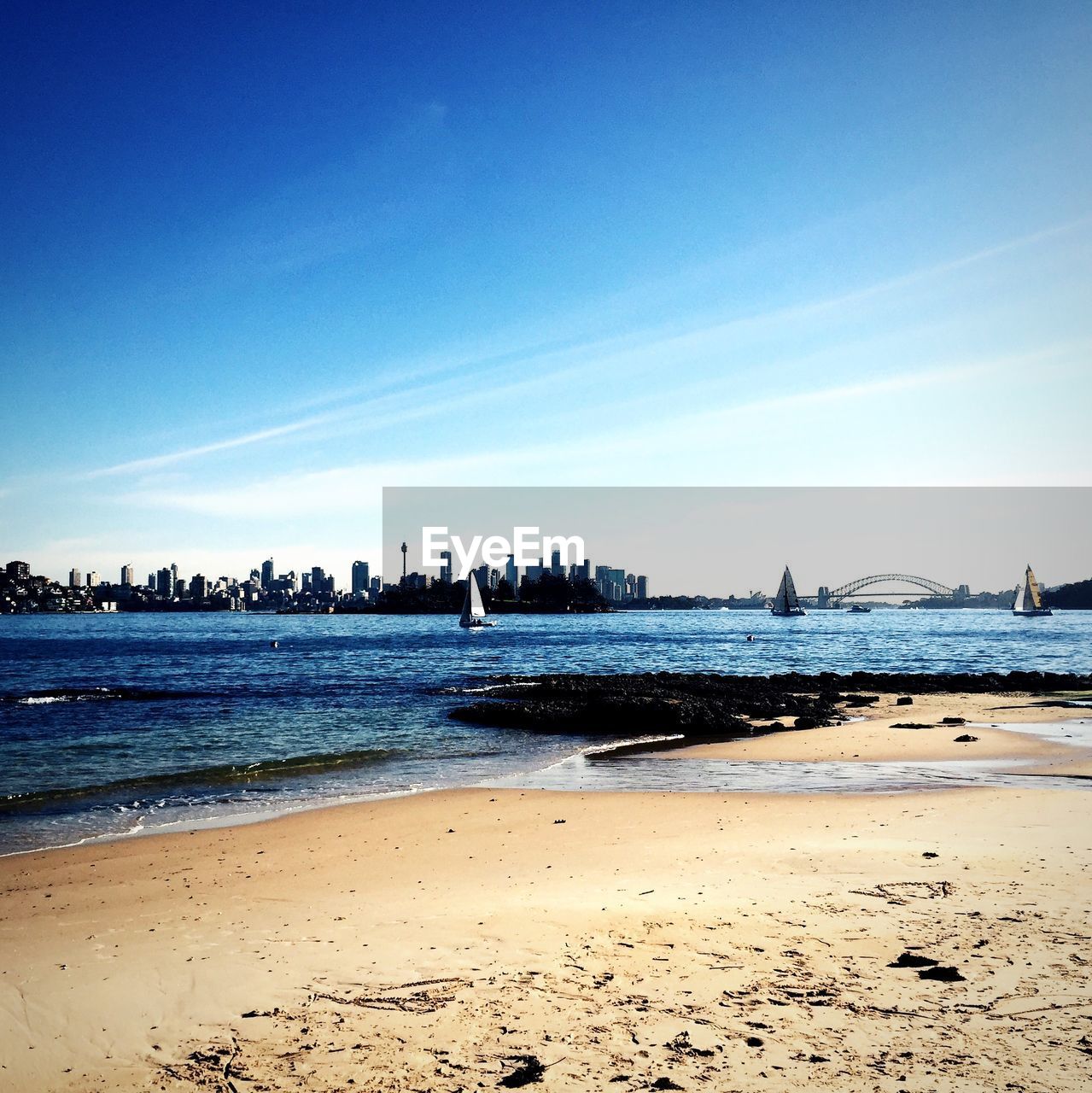 Scenic view of river against blue sky