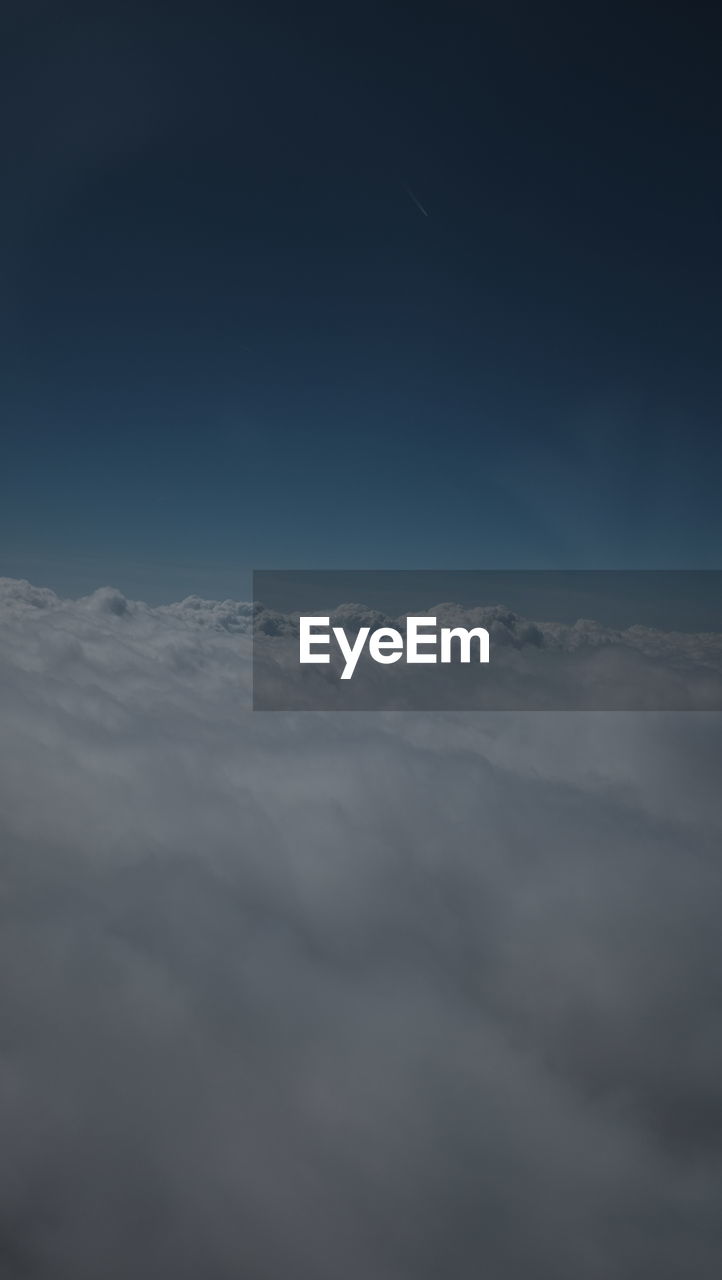 LOW ANGLE VIEW OF CLOUDSCAPE AGAINST SKY AT DUSK