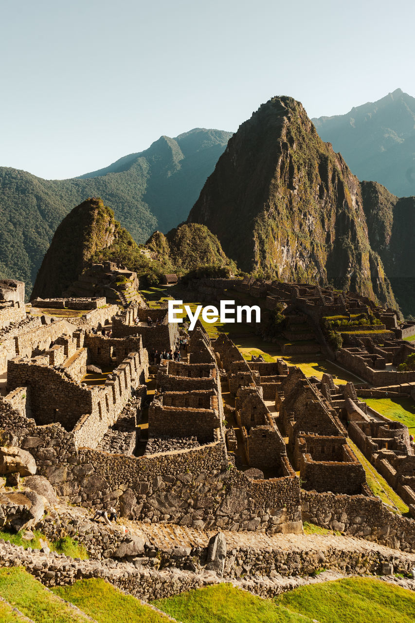 Machu picchu old inca ruins at sunrise in peru