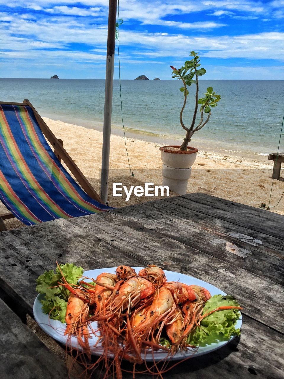 Fresh shrimps served in plate on table at sai noi beach