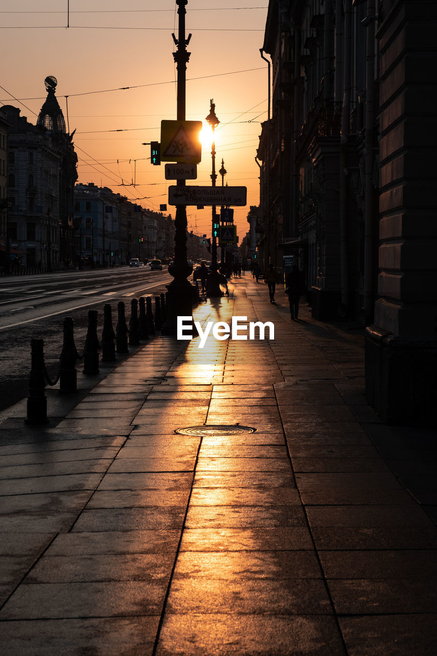 Footpath at street during sunset