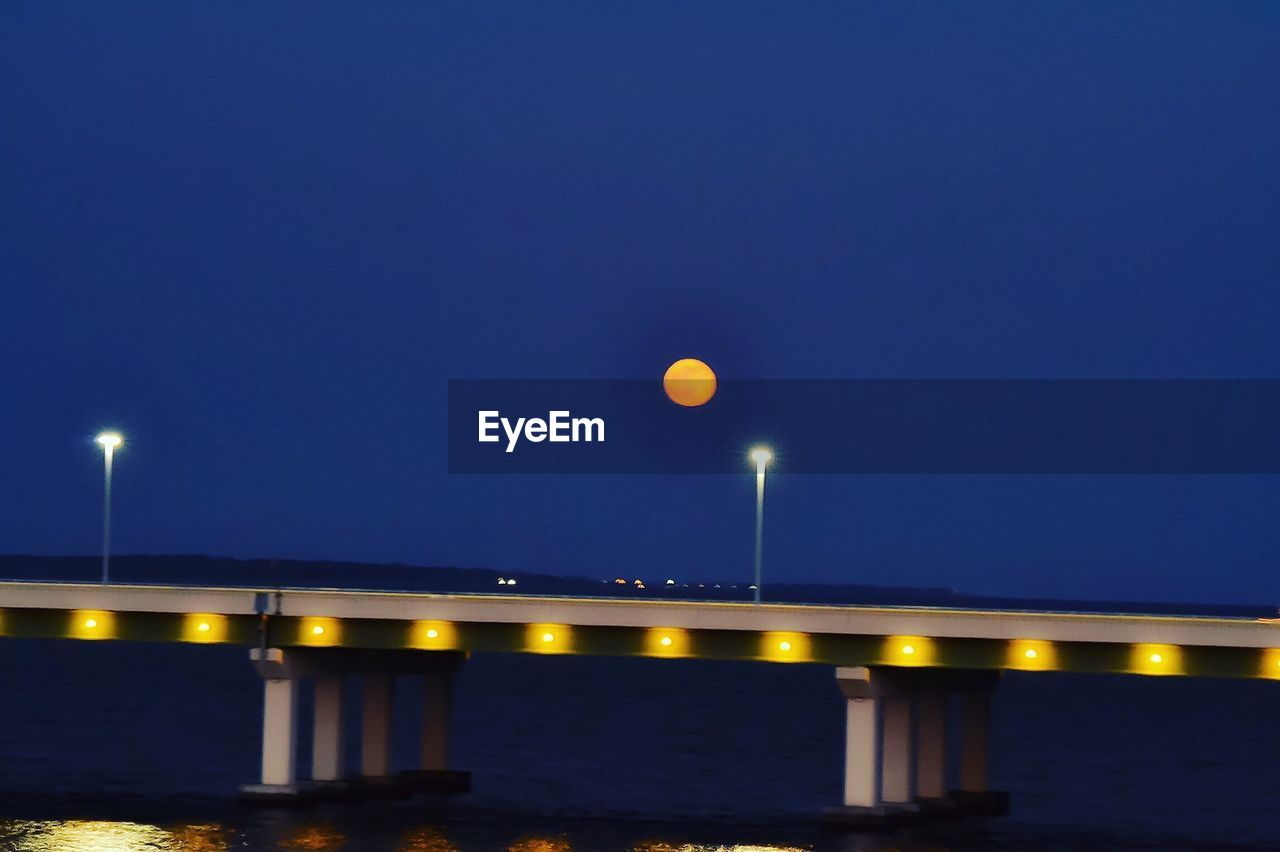 VIEW OF ILLUMINATED STREET LIGHT AT NIGHT