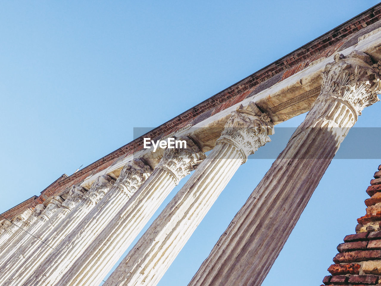 LOW ANGLE VIEW OF COLONNADE AGAINST CLEAR SKY