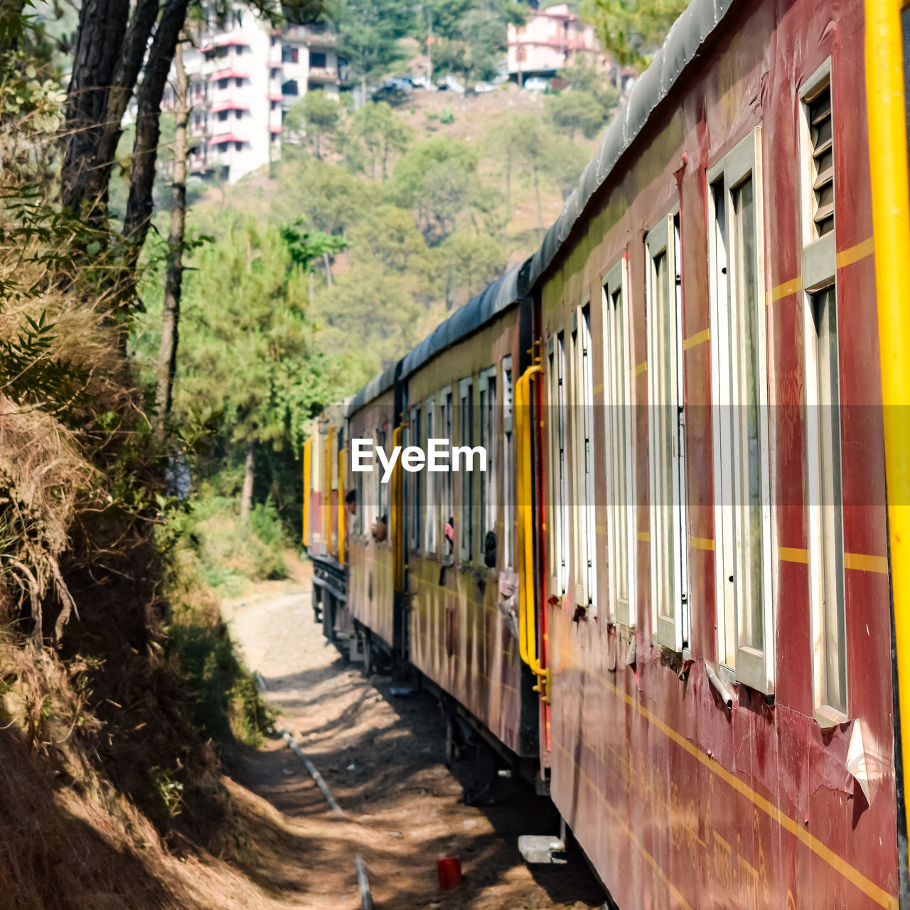 Toy train moving on mountain slopes, beautiful view, one side mountain, one side valley moving