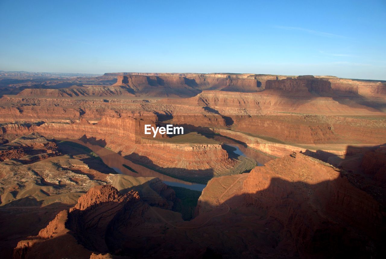 AERIAL VIEW OF DRAMATIC LANDSCAPE AGAINST SKY