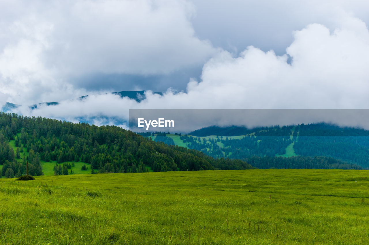 A picturesque landscape view of the french alps mountains on a cloudy summer day