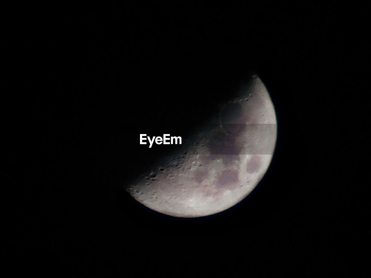 LOW ANGLE VIEW OF HALF MOON AGAINST SKY AT NIGHT