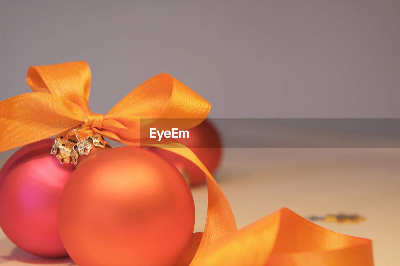 Close-up of orange baubles on table