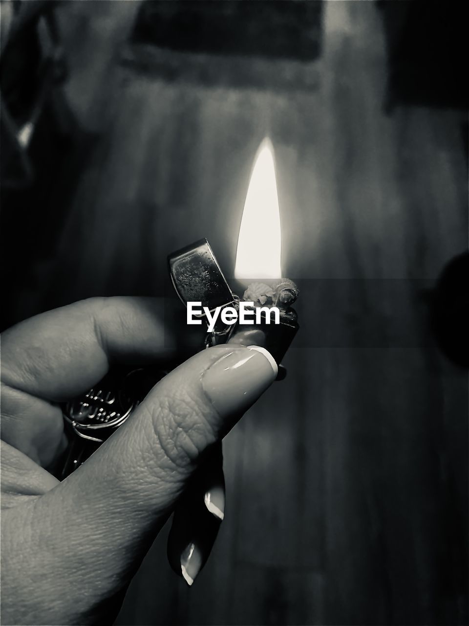 black, hand, darkness, burning, fire, black and white, white, flame, holding, monochrome, one person, monochrome photography, finger, light, close-up, focus on foreground, igniting, indoors, adult, heat, cigarette lighter, candle, personal perspective, lifestyles