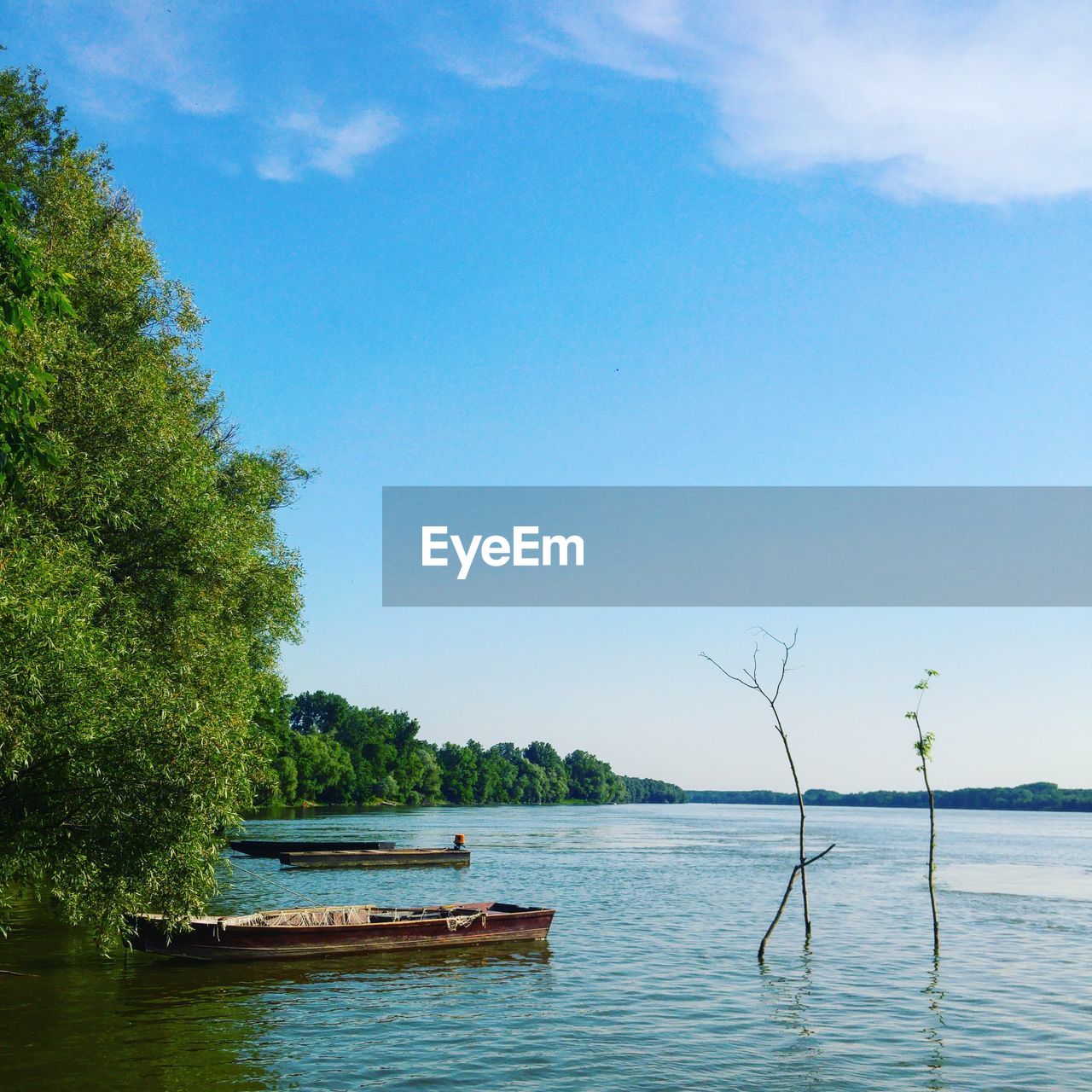 Scenic view of calm lake against clear sky