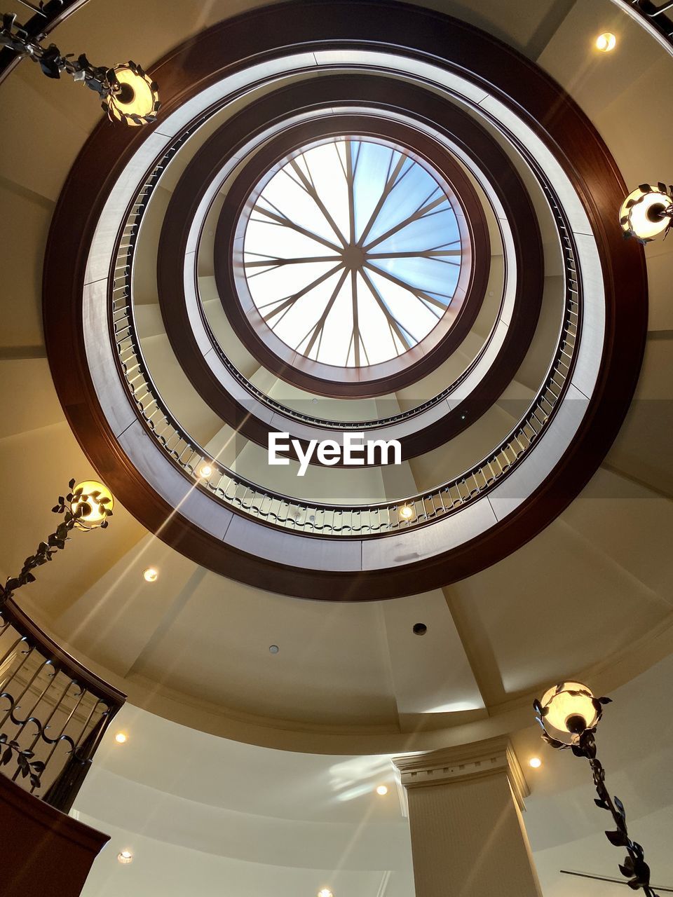 LOW ANGLE VIEW OF ILLUMINATED CEILING LIGHT