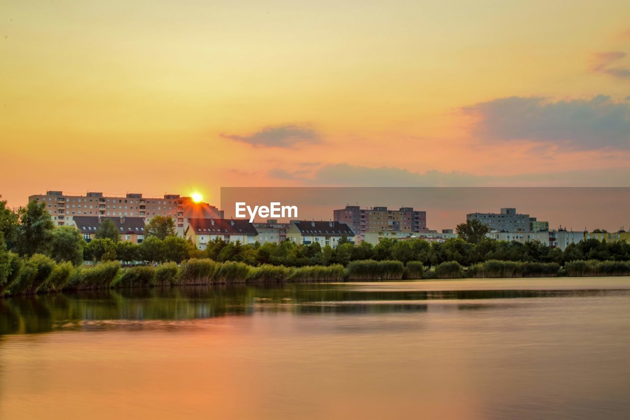 VIEW OF BUILDINGS AGAINST SKY DURING SUNSET