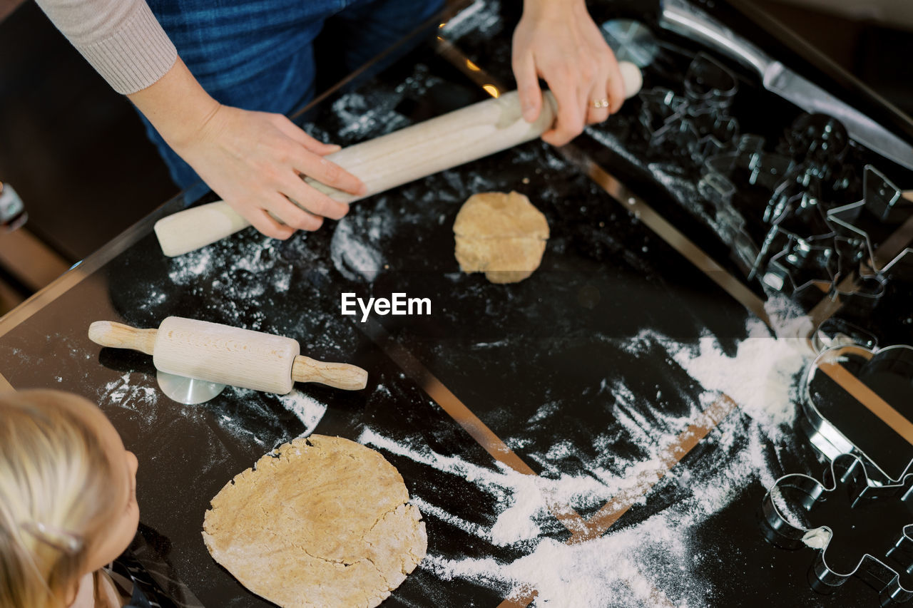 cropped hand of man preparing food in workshop