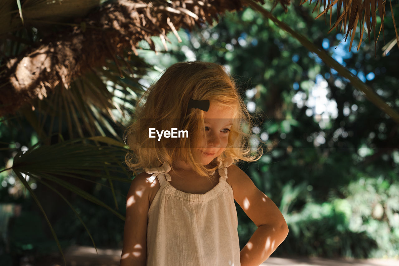 Caucasian two year old girl, toddler, kid among green plants.natural beauty,perfect skin,cosmetics