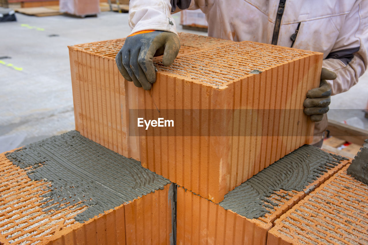 Bricklayer at work at new house in construction