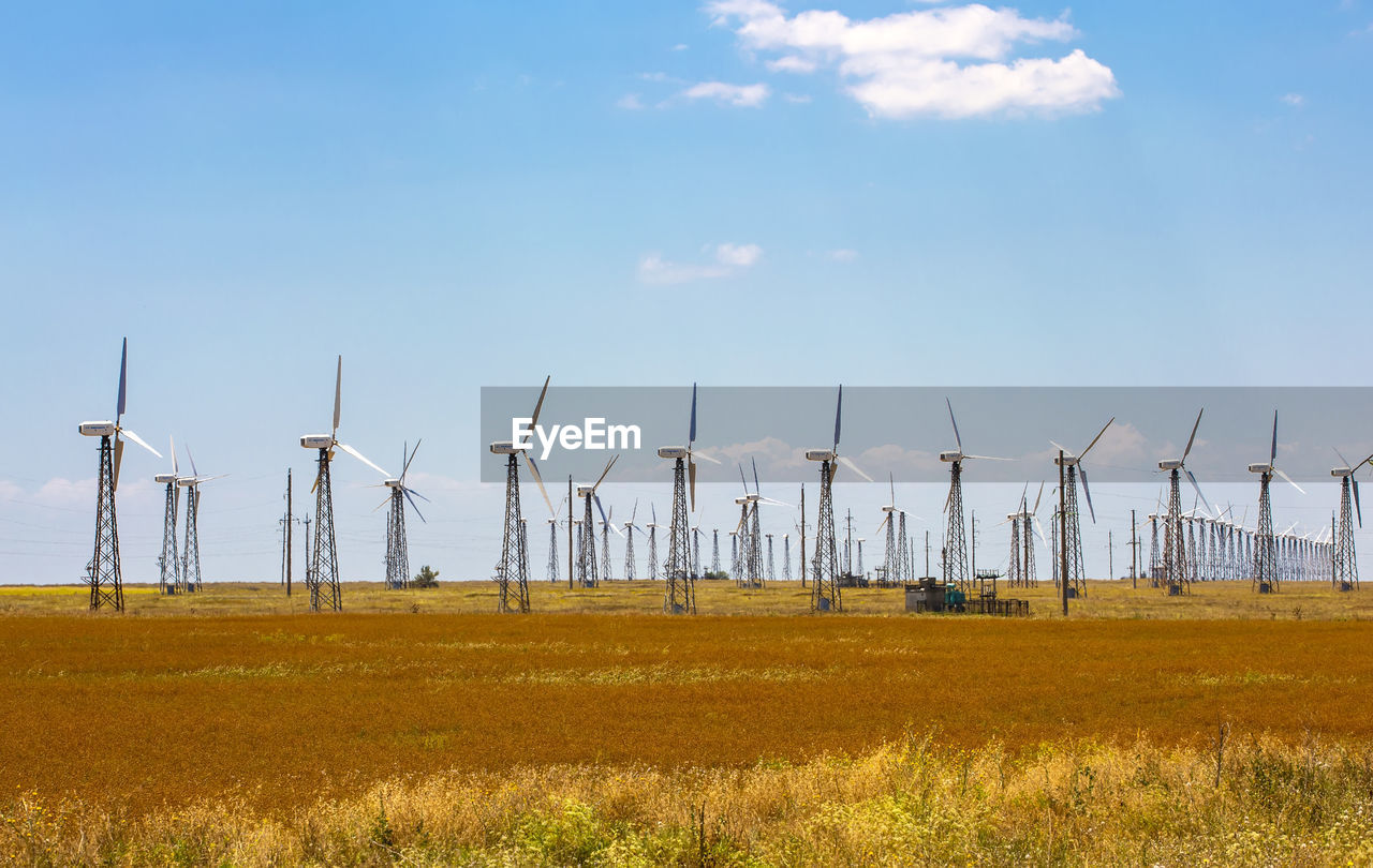 Panorama wind farm in russia on the field in summer