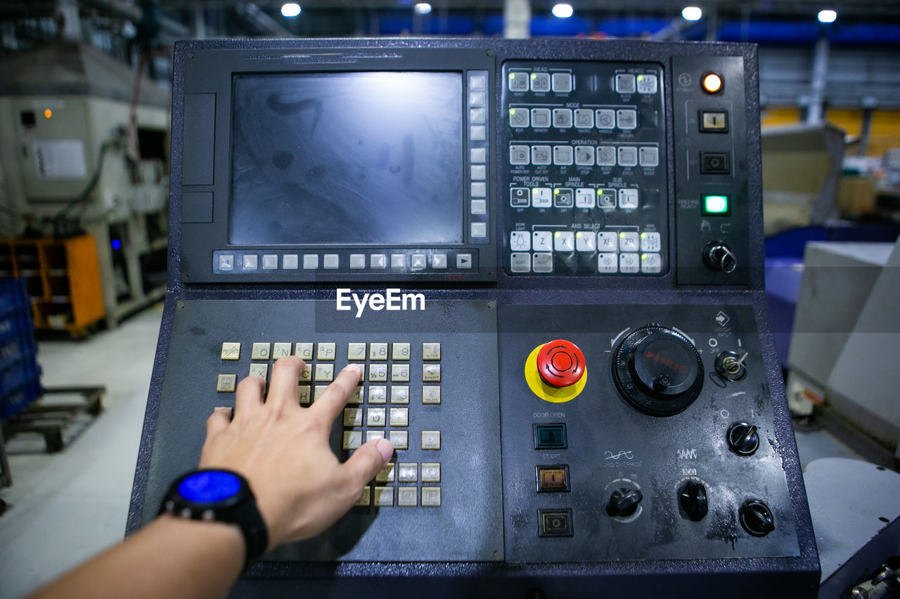 cropped hands of woman using sound mixer