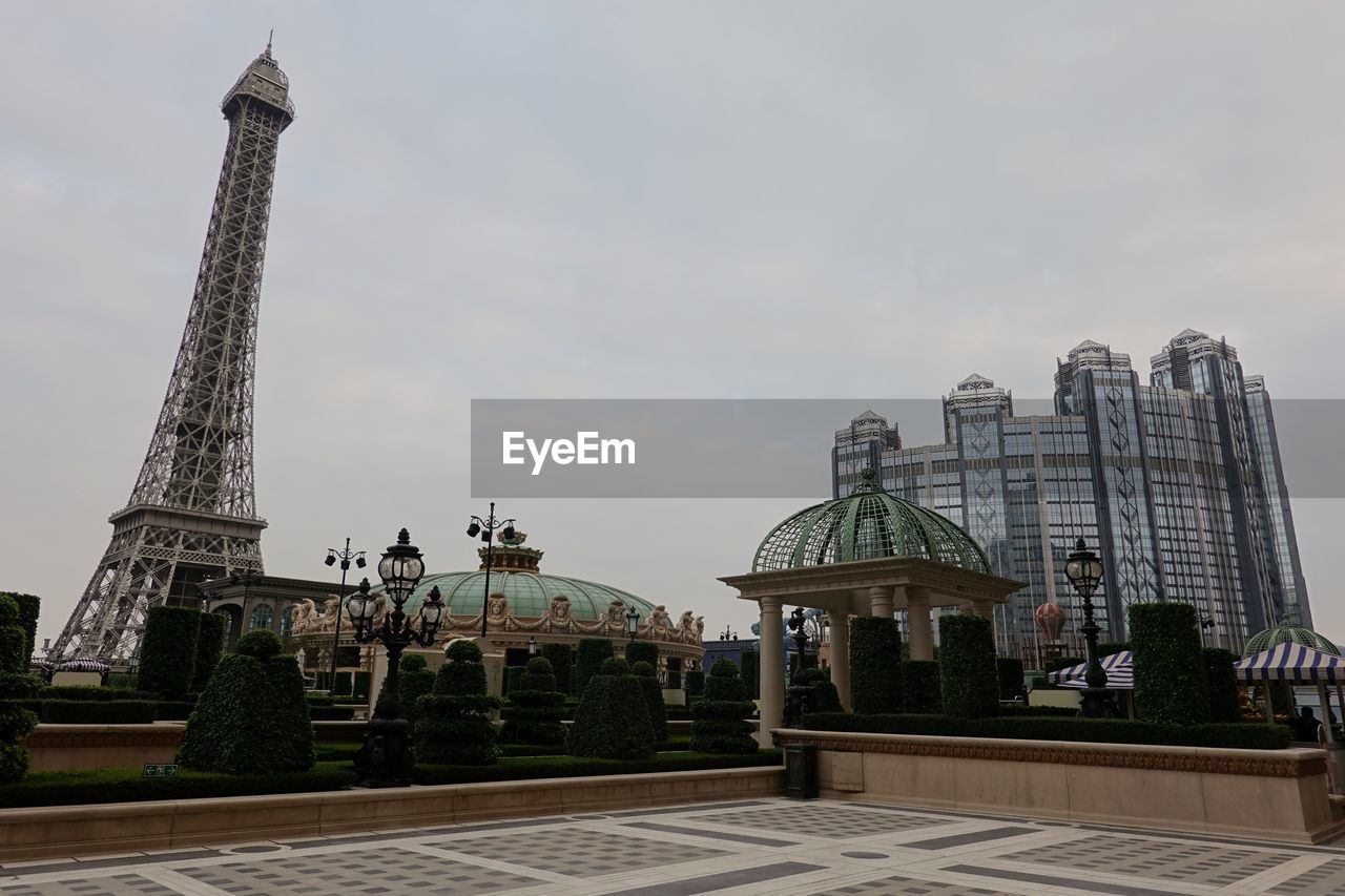 BUILDINGS AGAINST CLOUDY SKY