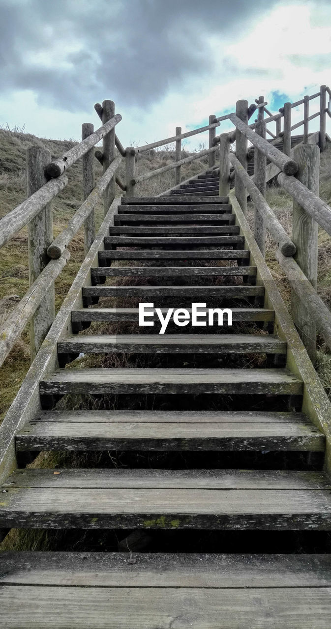 LOW ANGLE VIEW OF STEPS AND SKY AGAINST CLOUDY DAY