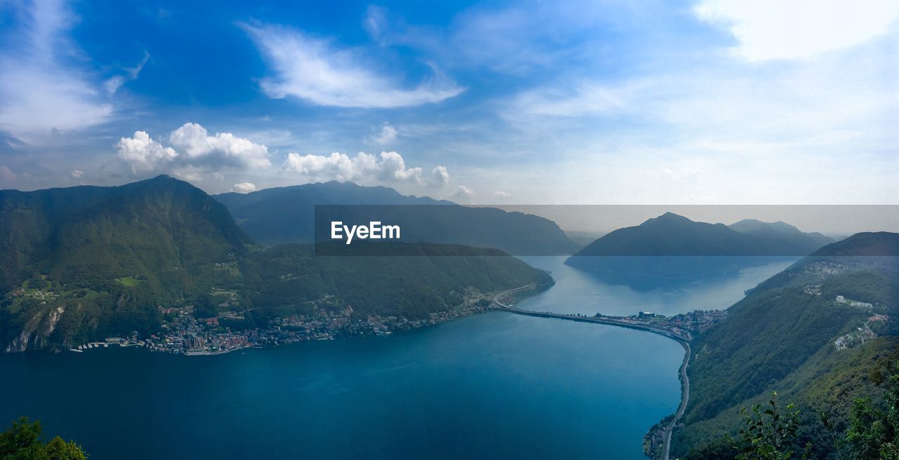 Scenic view of lake and mountains against sky