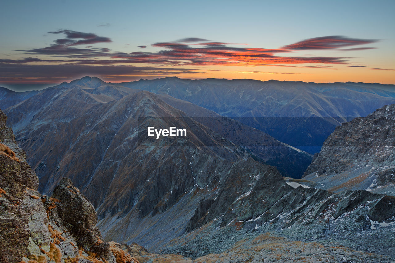 Scenic view of mountains against sky during sunset