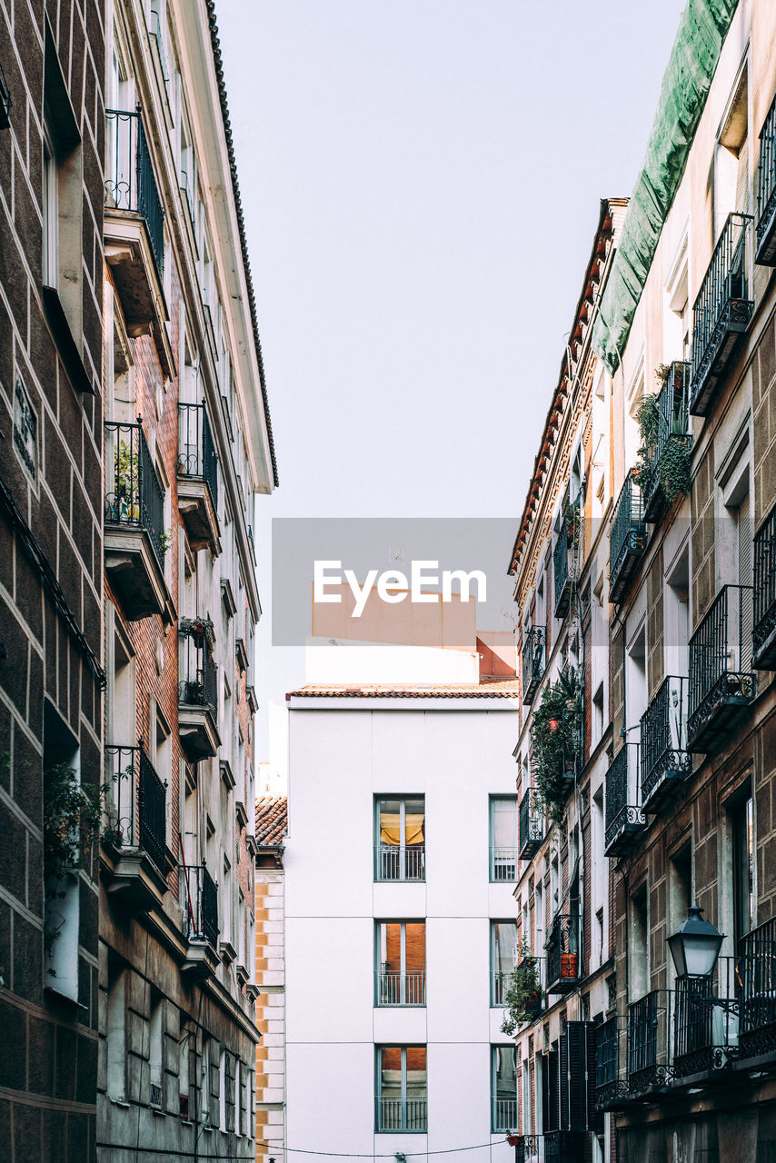 Cityscape of the quarter of lavapies with traditional buildings with balconies. madrid