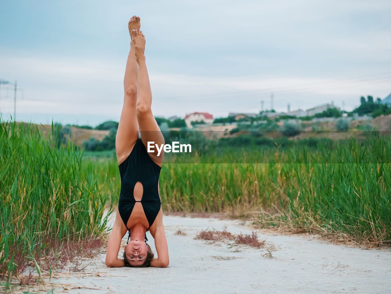 Full length of woman on field against sky