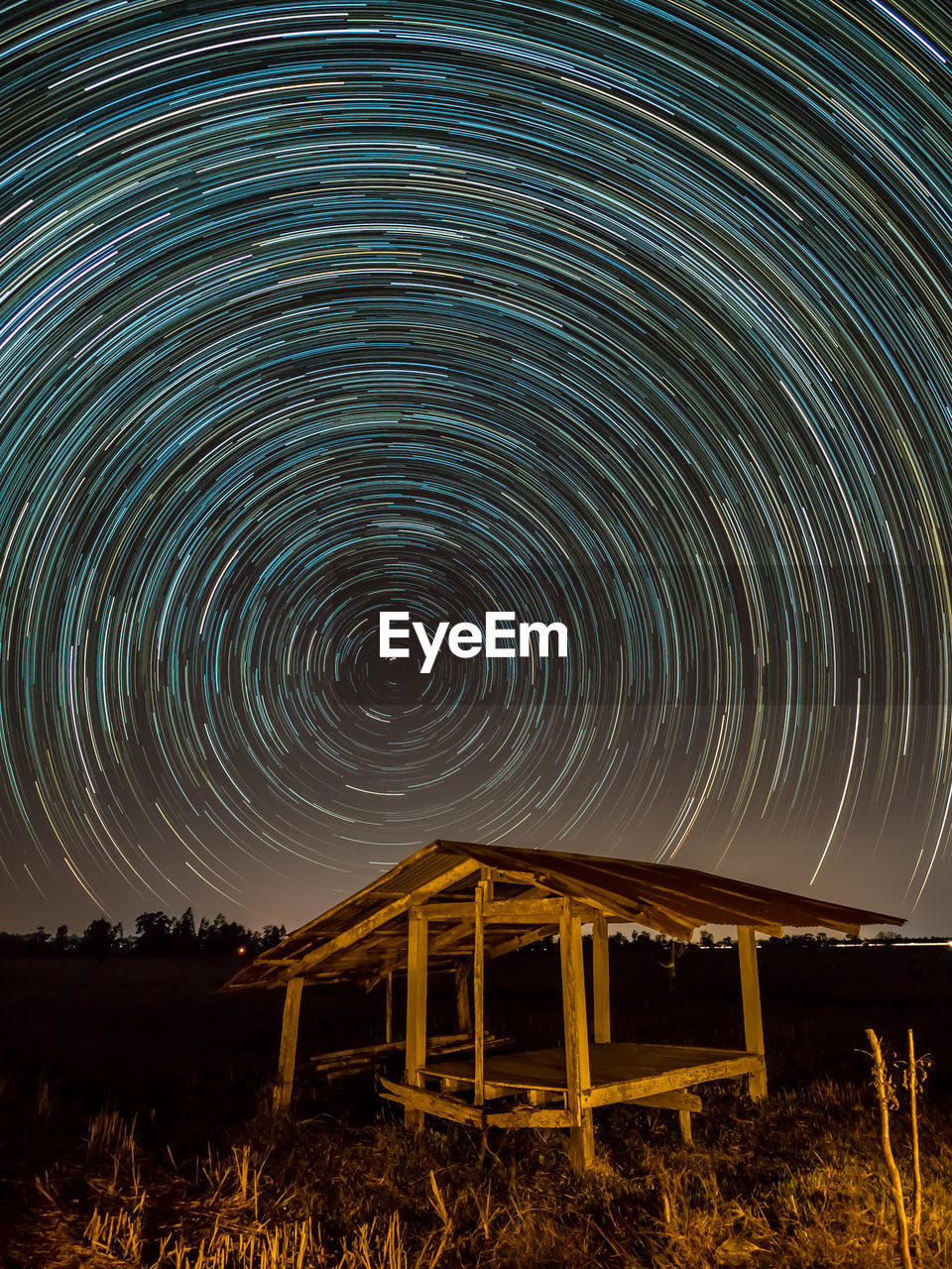 Abandoned hut against milky way at night