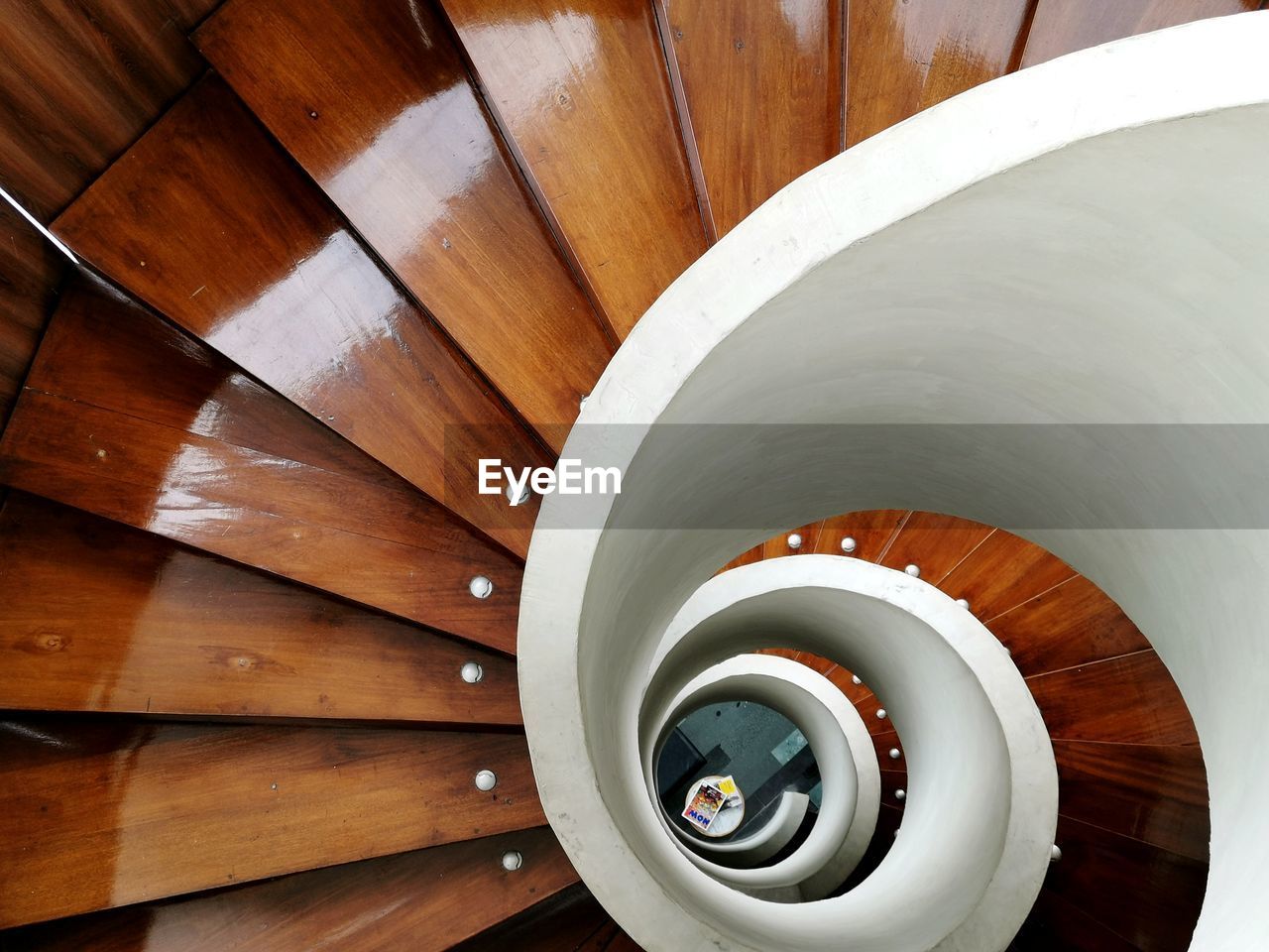 Directly below shot of wooden spiral staircase