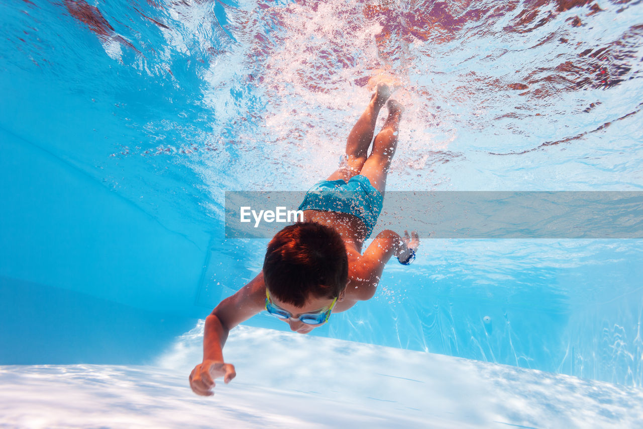 Carefree by diving in swimming pool