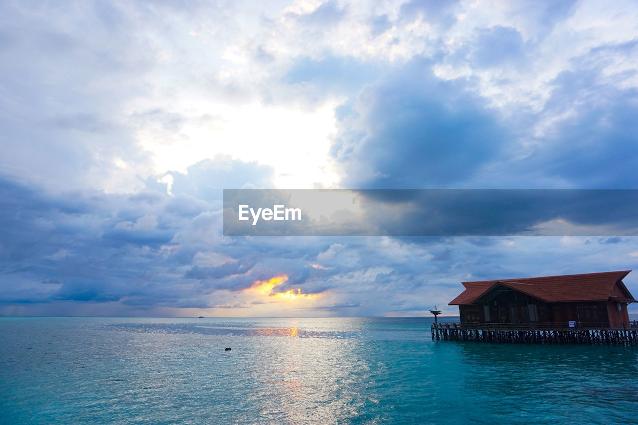 Scenic view of sea and buildings against sky