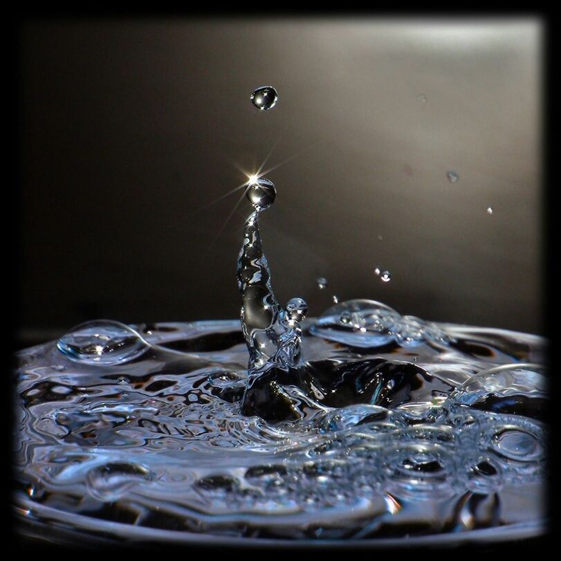 CLOSE-UP OF WATER SPLASHING ON WATER