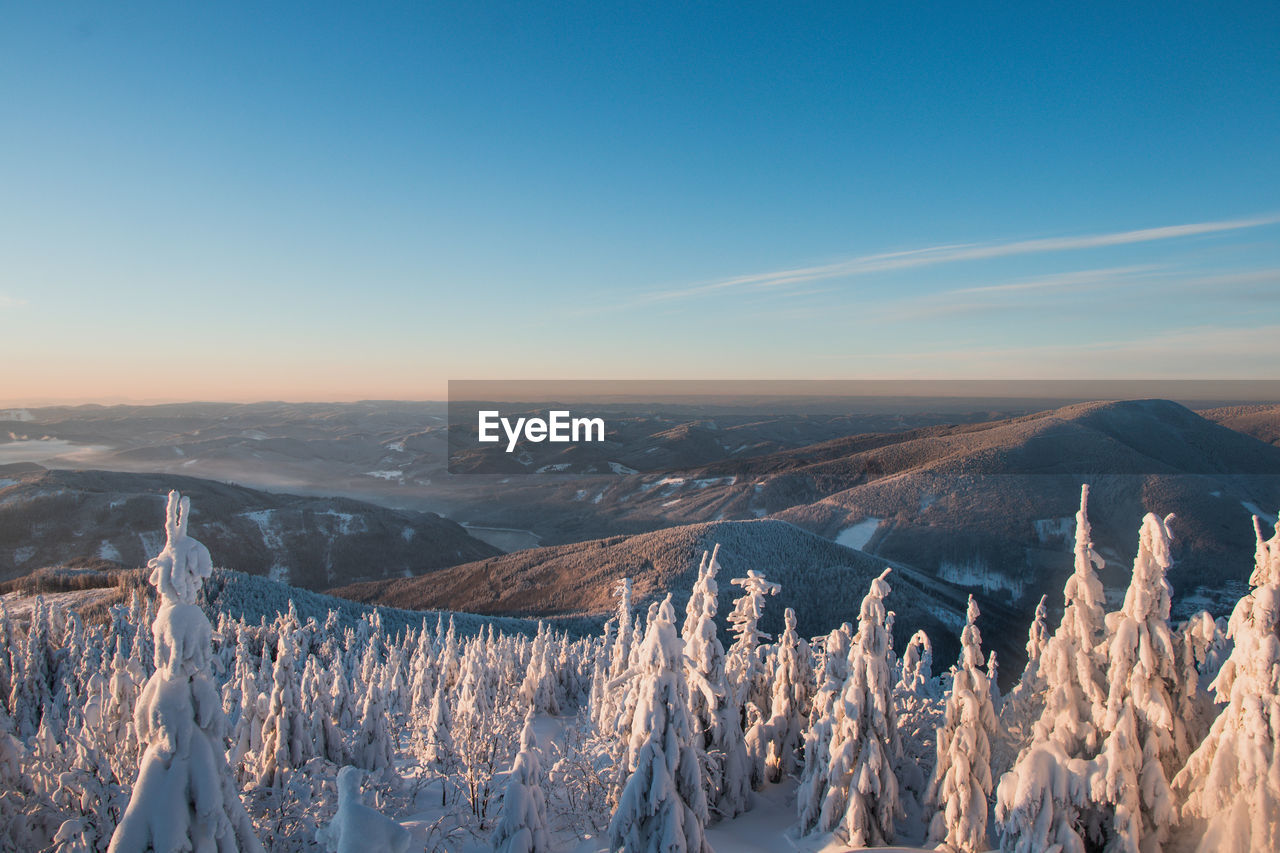 Panoramic view of landscape against sky during winter