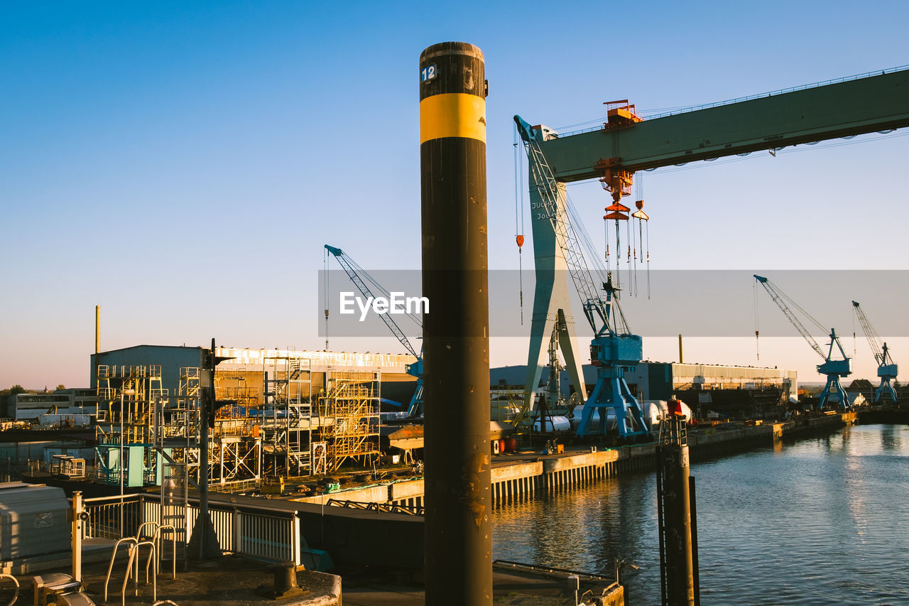 COMMERCIAL DOCK AGAINST CLEAR SKY AT HARBOR