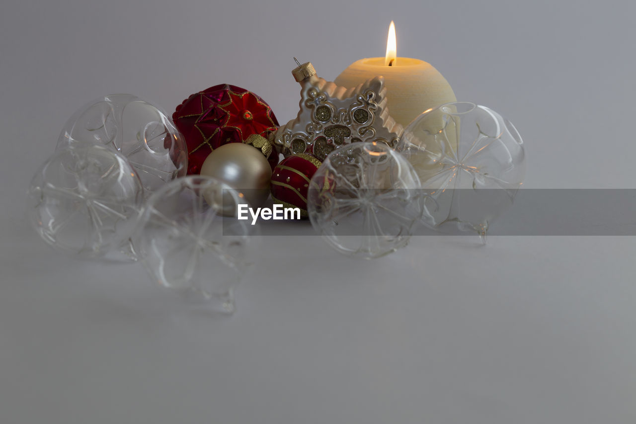 Close-up of christmas decorations on white background