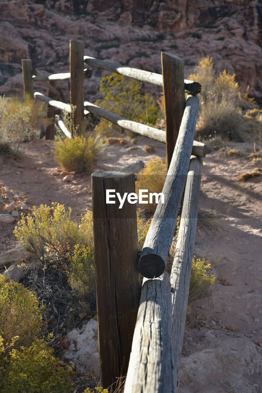 Close-up of wooden post on old west style rail fence