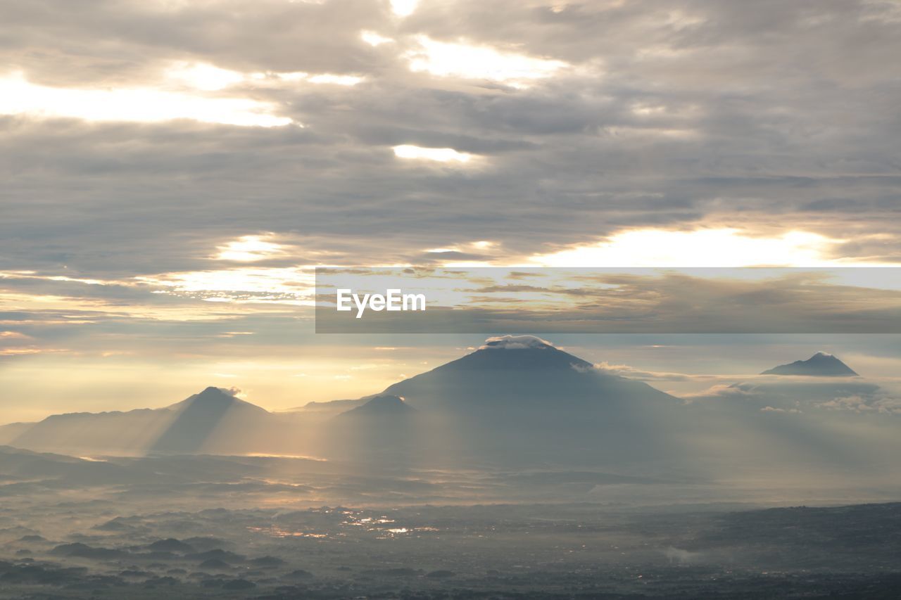 Scenic view of mountains against sky during sunset