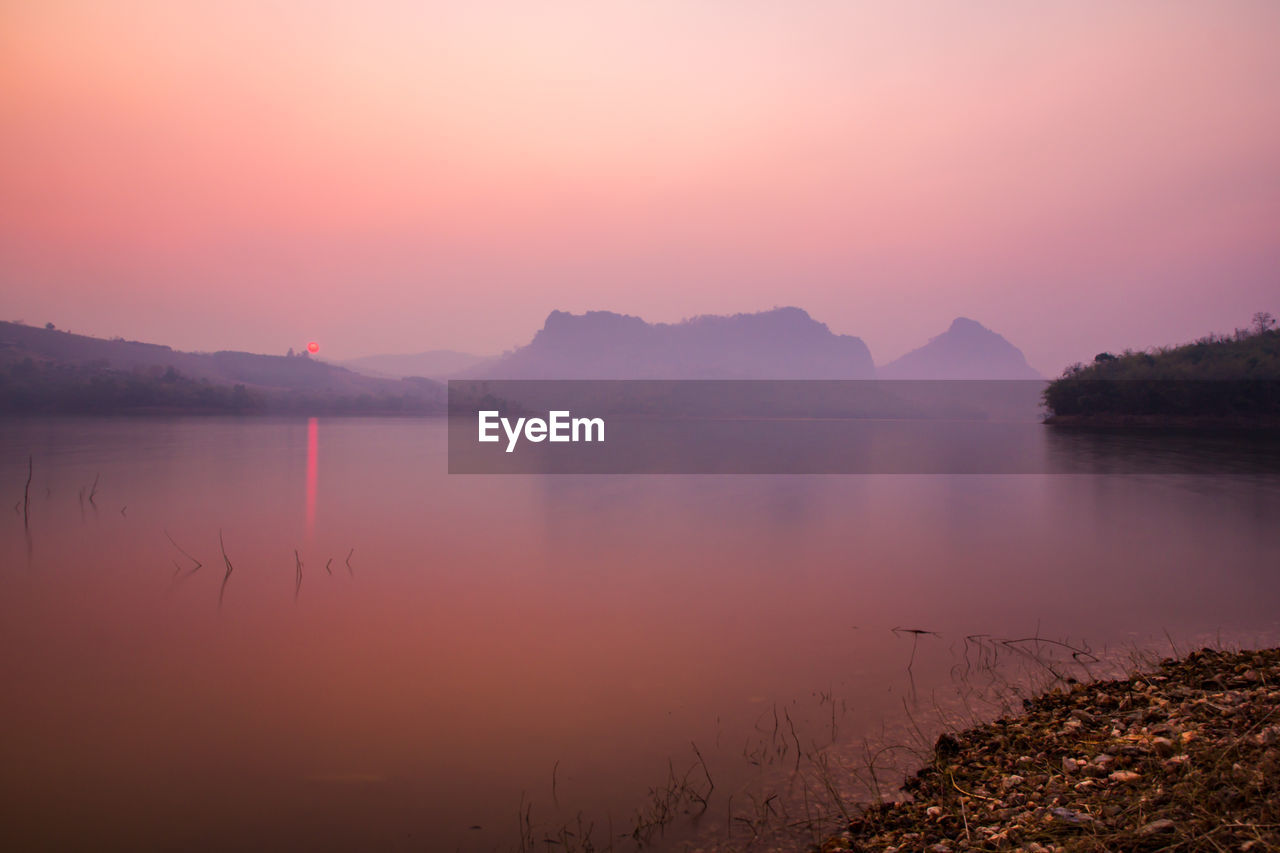 Scenic view of lake during sunset