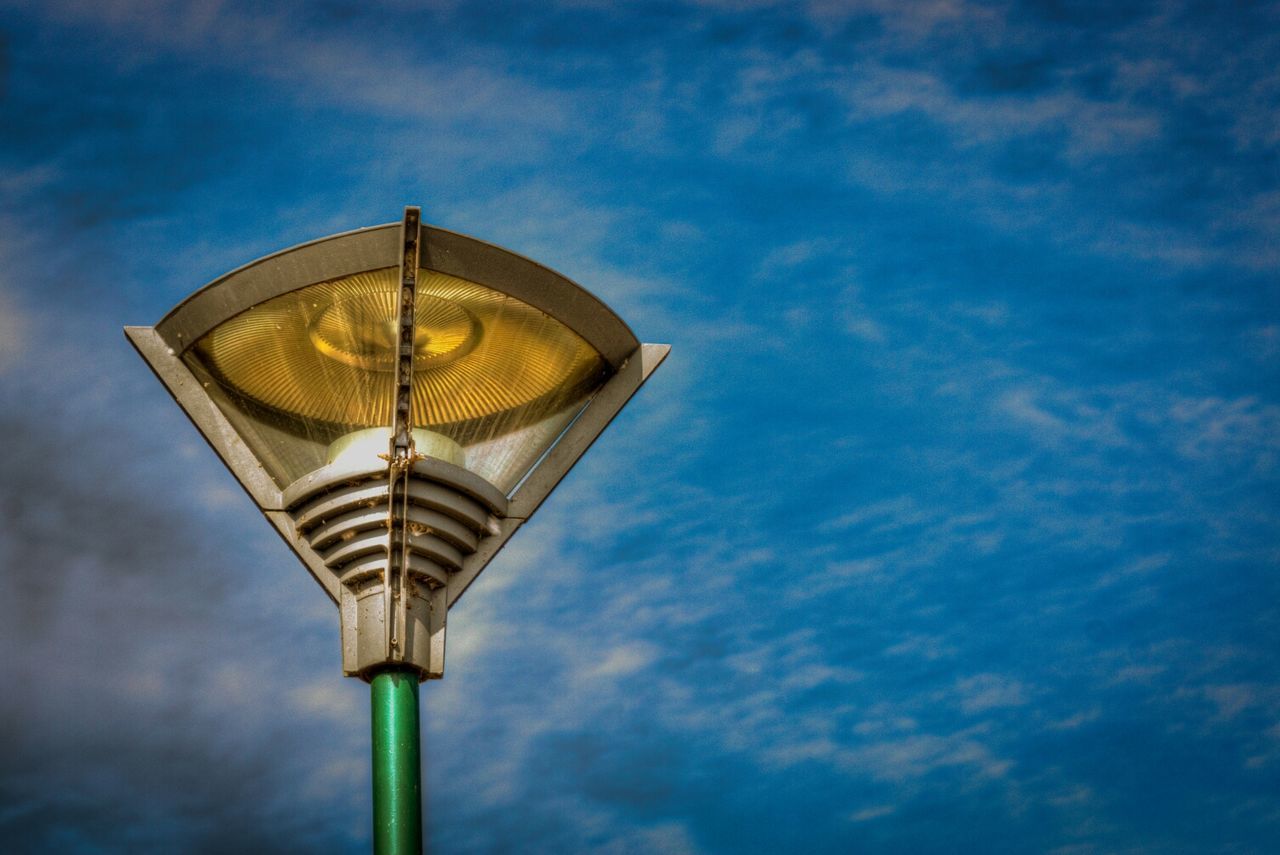 Low angle view of street light against sky