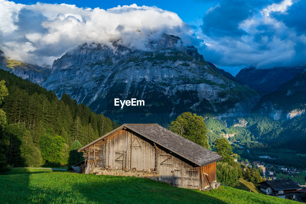 houses and mountains against sky