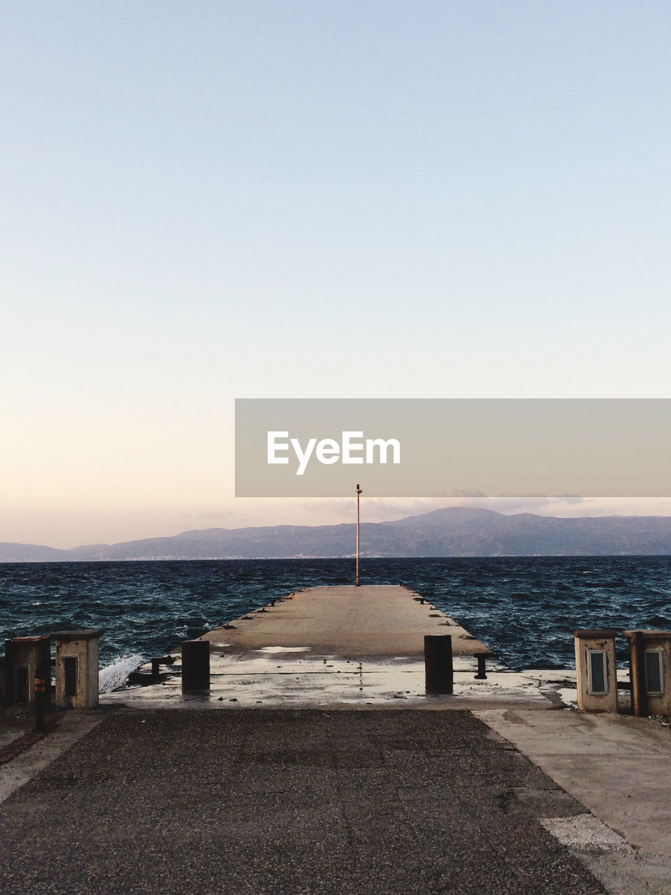 Scenic view of sea against clear sky during sunset